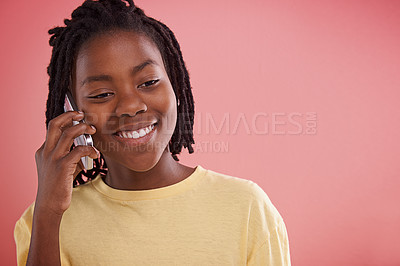 Buy stock photo Happy, boy and phone call in studio for communication, chat and conversation on a pink background. African model, child or teenager with mobile for information, listening and opportunity with ideas