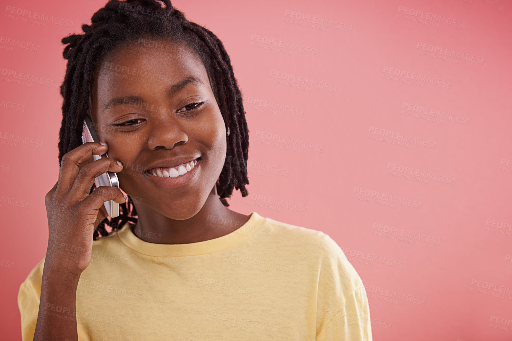 Buy stock photo Happy, boy and phone call in studio for communication, chat and conversation on a pink background. African model, child or teenager with mobile for information, listening and opportunity with ideas