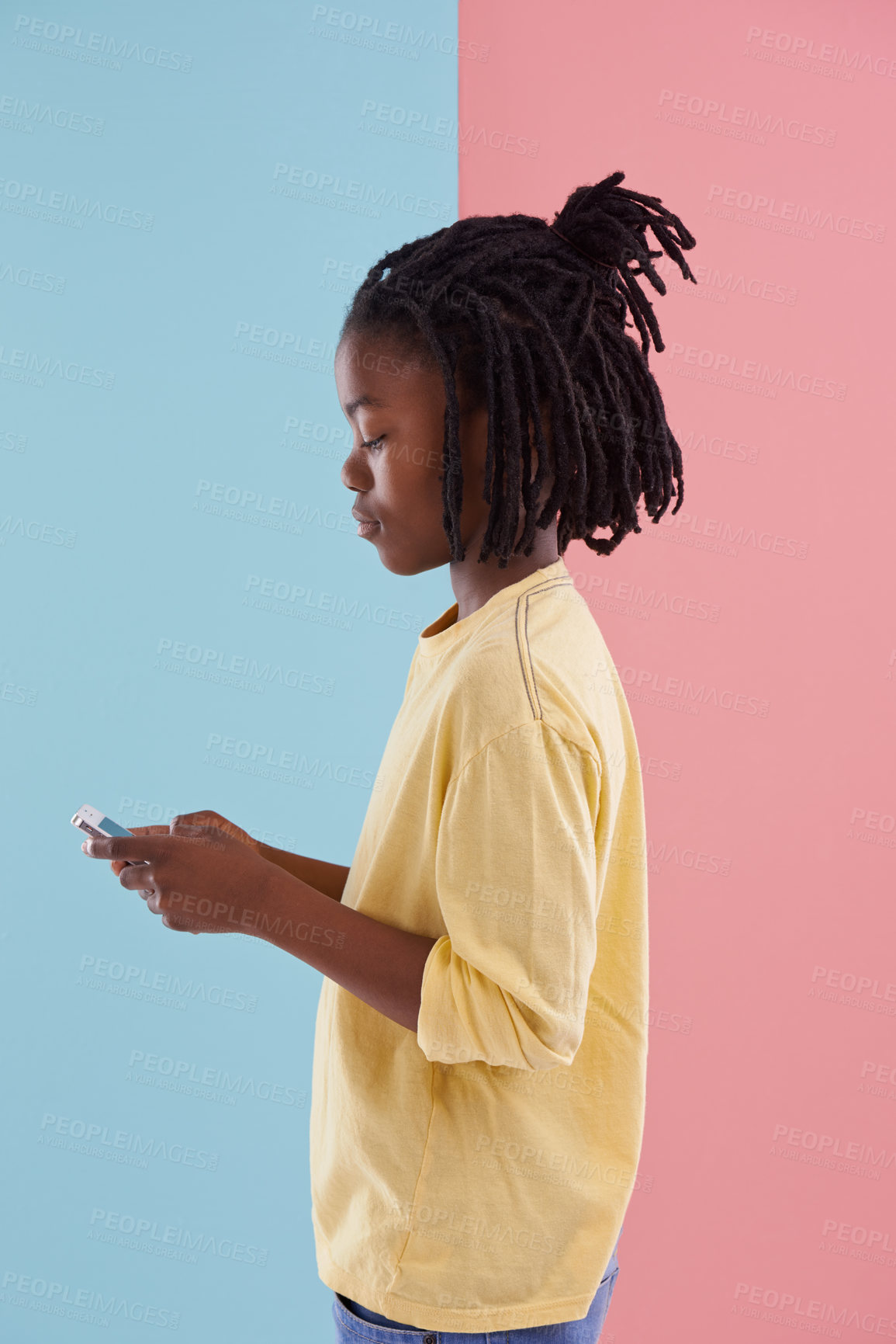 Buy stock photo Phone, search and black child with social media, ebook or streaming cartoon on wall background. Smartphone, app or African teen boy online for chill sign up or internet gaming