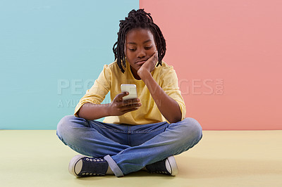 Buy stock photo Phone, search and bored boy child on a floor with social media, reading or ebook in his home. Smartphone, lazy or African teen with app for chill sign up or watching video