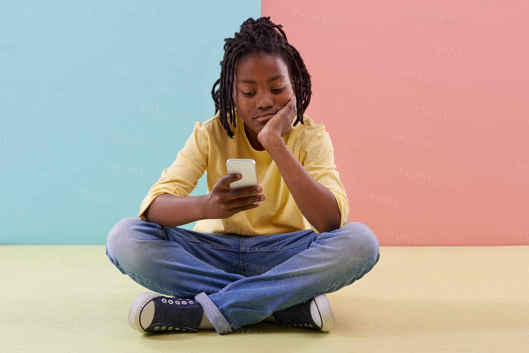 Buy stock photo Phone, search and bored boy child on a floor with social media, reading or ebook in his home. Smartphone, lazy or African teen with app for chill sign up or watching video