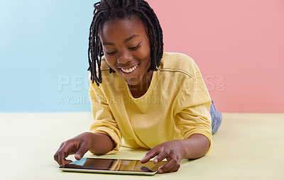 Buy stock photo Tablet, search and happy boy child on floor with social media, ebook or cartoon at home. Digital, smile or African teen person with app and chill sign up or gaming subscription