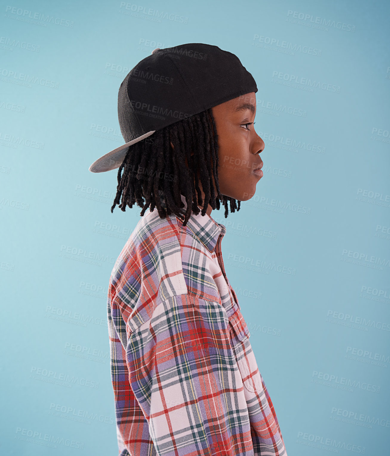 Buy stock photo Fashion, children or black boy with cap in studio for confidence, style or streetwear aesthetic on blue background. Face, profile or African teen male model with cool, clothes or trendy outfit choice