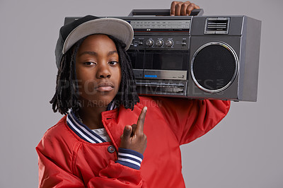 Buy stock photo Black child, serious and portrait with radio and hand sign for hip hop, rap and swag with cool clothes in studio. Young, teen and boombox with gangster style and fashion and kid with grey background