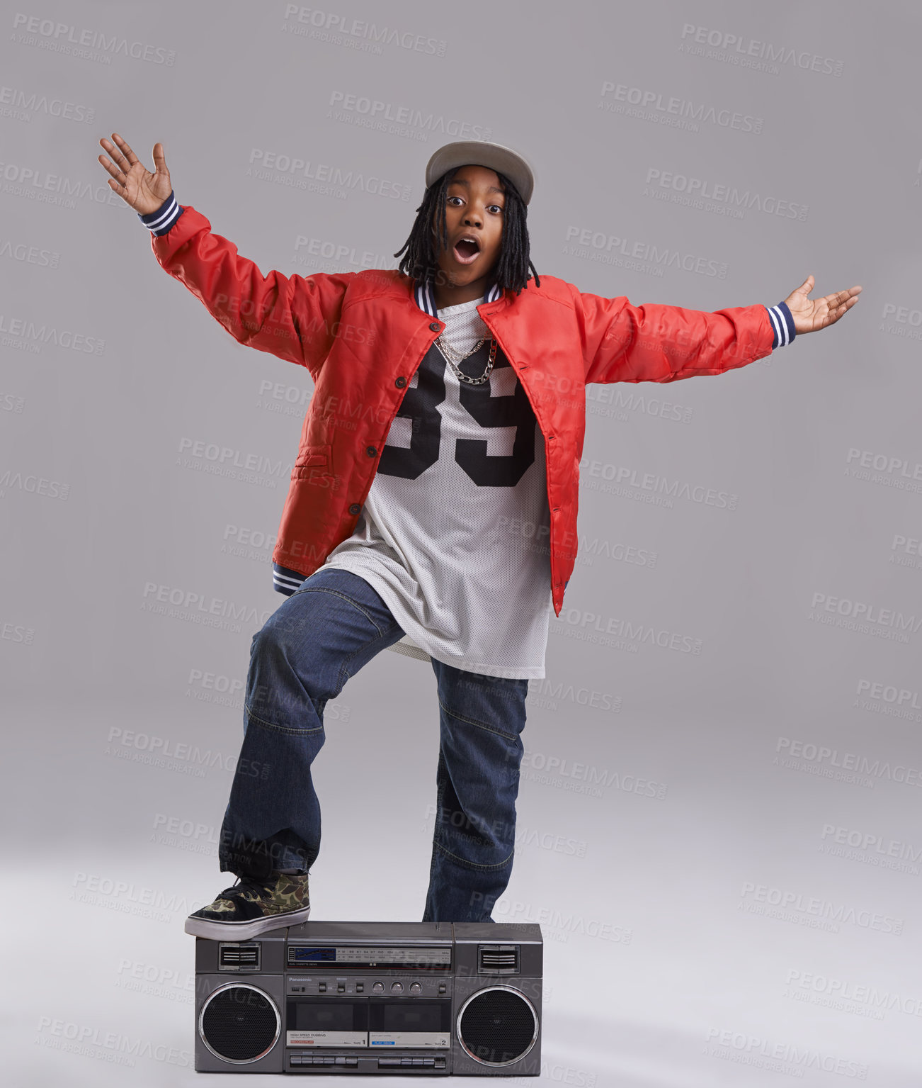 Buy stock photo Black child, excited and portrait with radio for hip hop, rap and swag dance with cool clothes in studio. Smile, teen clothing and boombox with urban style and fashion and kid with grey background