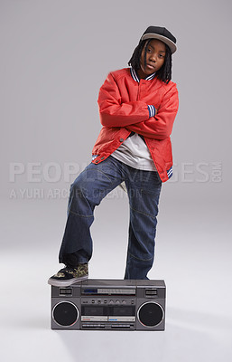 Buy stock photo Child, hip hop and cool portrait with radio for music and rap in a studio with urban clothing. Fashion, African kid and boombox with trendy clothes and youth swag with confidence and grey background