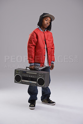 Buy stock photo Child, hip hop and portrait with radio for music and dance in a studio with urban clothing. Fashion, African kid and boombox with trendy clothes and youth swag with confidence and grey background