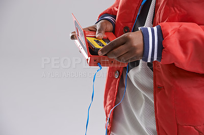 Buy stock photo Hands, music and mix tape with player for cassette, hip hop and aesthetic for youth with culture. Retro, vintage and audio from track of mini boombox for kid or child in studio with grey background