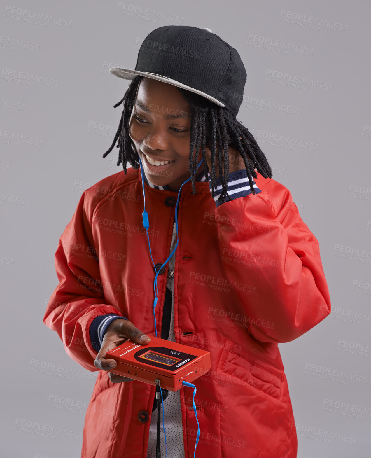 Buy stock photo Music, happy and child on gray background with cassette for listening to song, audio and radio. Fashion, youth and young African boy with retro tech for track playlist in trendy clothes in studio