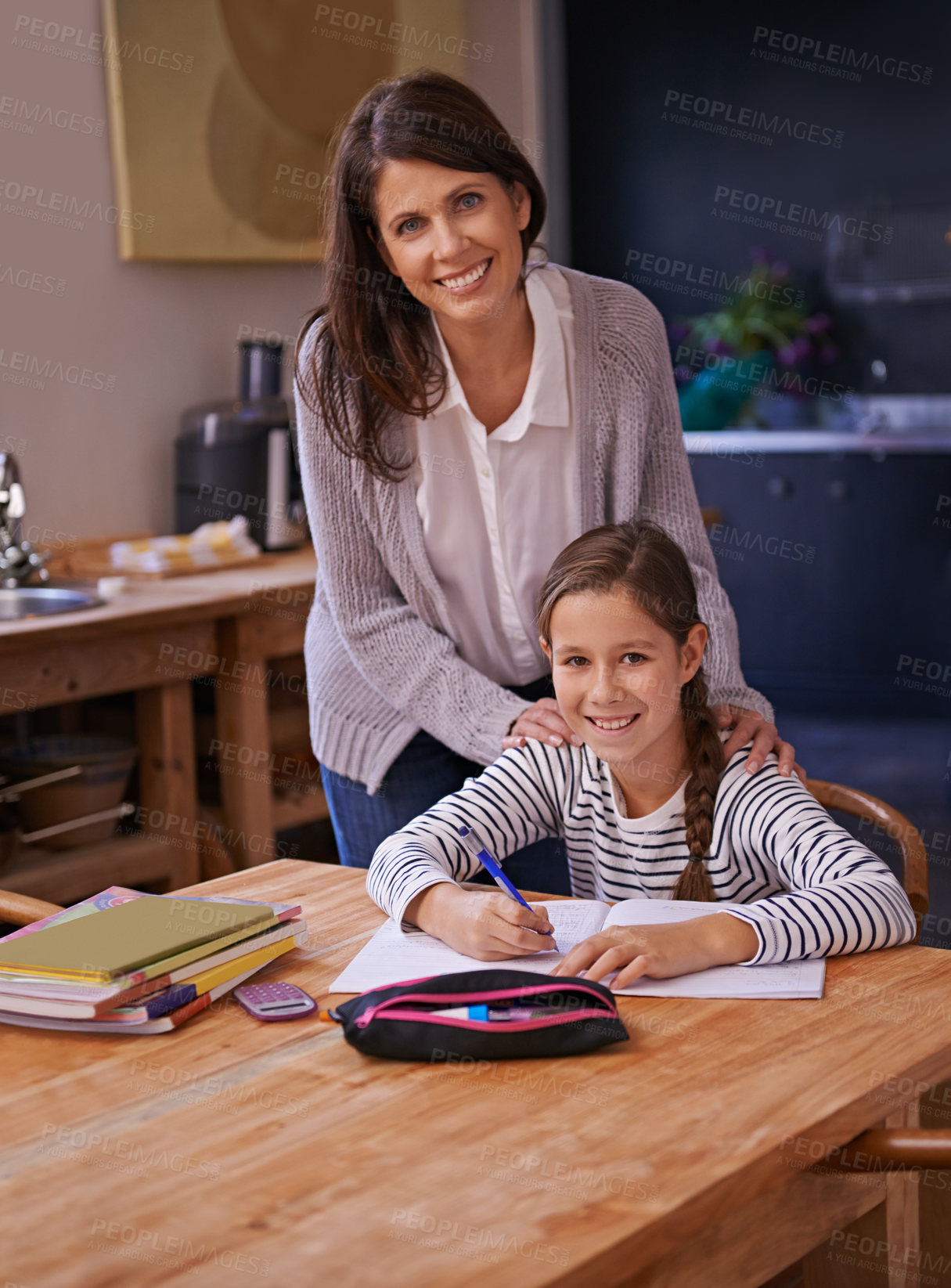 Buy stock photo Homework, mother and girl with books for portrait, advice or check for studying with education. Mom, daughter and notebook with drawing, notes and development with learning in kitchen at family house