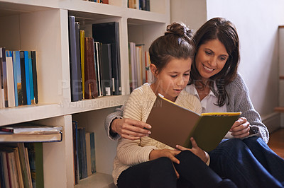 Buy stock photo Bookshelf, mother and daughter with reading on floor, language and help for studying with education. Mom, girl child and story with literature, fantasy and development with learning at family house