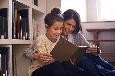 Buy stock photo Bookshelf, mother and girl with reading on floor, language and help for studying with education. Mom, daughter or child with story with literature, fantasy or development for learning at family house