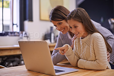 Buy stock photo Cropped shot of a young girl studying with her mother nearby to help