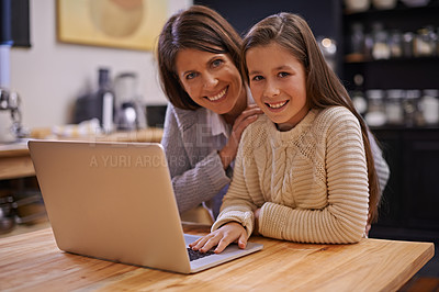 Buy stock photo Mother, portrait and child with laptop in kitchen for learning, support or care at home. Happy mom, daughter or kid with smile on computer for social media, trust or bonding together at the house