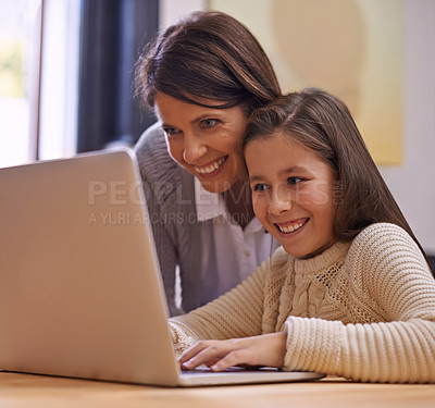 Buy stock photo Happy mother, child and learning with laptop for support, care or browsing on social media at home. Mother, daughter or young kid typing on computer for reading or helping girl on project or homework