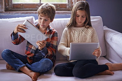 Buy stock photo Brother, sister and tablet for gaming on couch together, technology and online streaming for bonding at home. Digital 
world, internet and children in living room, gamer app or elearning with ebook