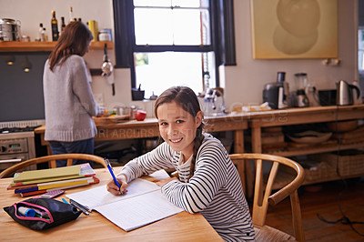 Buy stock photo Girl, child and homework with portrait in kitchen for studying, development and notes for education in house. Kid, notebook and writing with learning, language and smile for assessment in family home