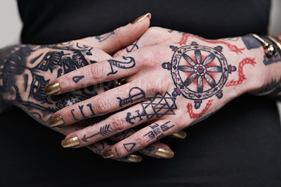 Buy stock photo Person, hands and tattoo with nails for polish, creative and ink for design, picture and symbol on closeup. Art, bold and cool for red and statement with varnish for funky, trendy and vibrant 