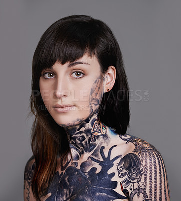 Buy stock photo Woman, portrait and beauty with tattoo for haircare, style or facial treatment on a gray studio background. Face of female person or young model with confidence for body art, design or creativity