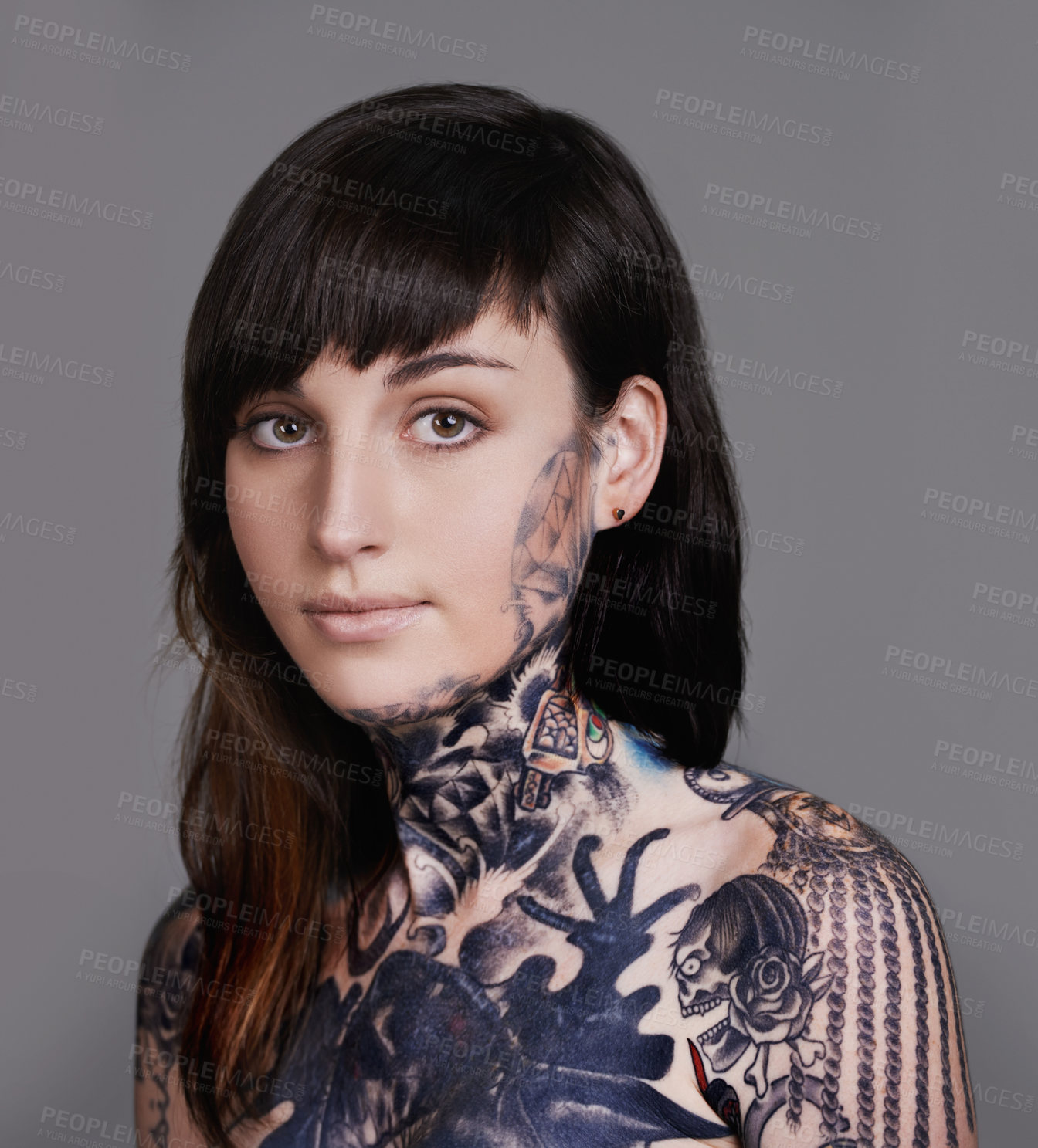 Buy stock photo Woman, portrait and beauty with tattoo for haircare, style or facial treatment on a gray studio background. Face of female person or young model with confidence for body art, design or creativity