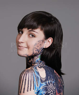 Buy stock photo Happy woman, portrait and beauty with back tattoo for haircare, style or facial treatment on a gray studio background. Face of female person, young model or smile for body art, design or creativity