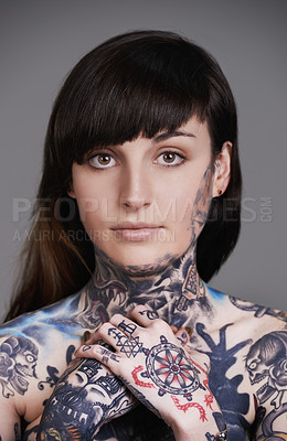 Buy stock photo Woman, portrait and stylist with tattoo for body art, style or facial treatment on a gray studio background. Face of female person, young model or smile for design, creativity or cool beauty artist
