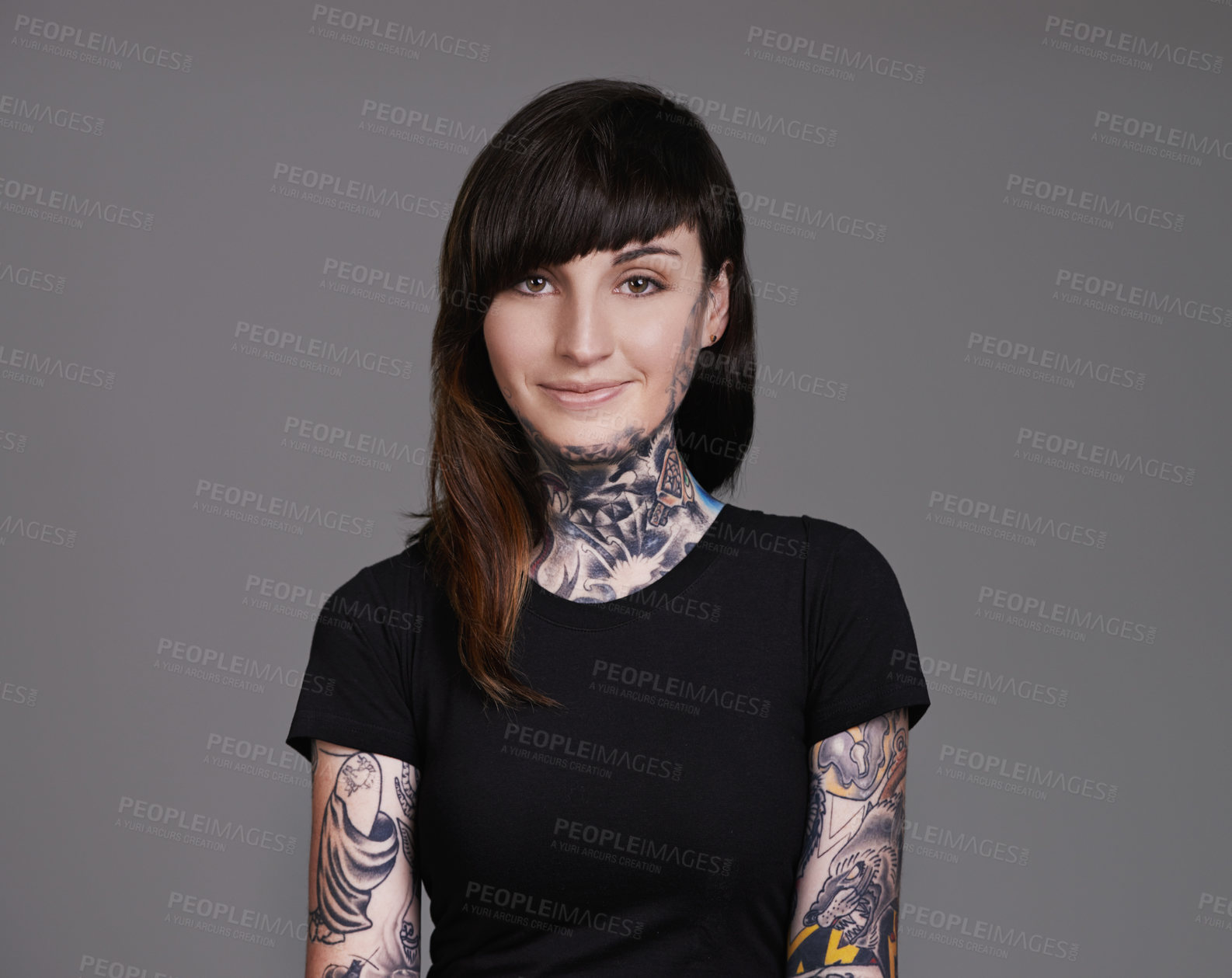 Buy stock photo Happy woman, portrait and tattoo with fashion for facial treatment, style or body art on a gray studio background. Female person, young model or smile for design, creativity or cool beauty artist