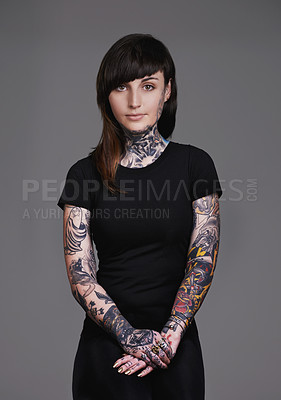 Buy stock photo Woman, portrait and tattoo with fashion or sleeves for facial treatment, style or body art on a gray studio background. Female person, young model or smile in design, creativity or cool beauty artist