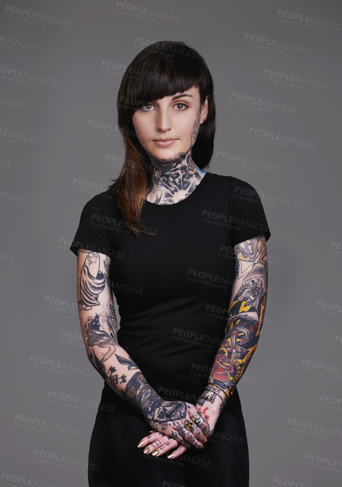 Buy stock photo Woman, portrait and tattoo with fashion or sleeves for facial treatment, style or body art on a gray studio background. Female person, young model or smile in design, creativity or cool beauty artist