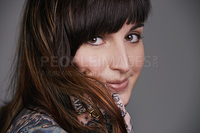 Buy stock photo Happy woman, portrait and beauty with tattoo for haircare, style or facial treatment on a gray studio background. Face of female person or young model with smile for body art, design or creativity