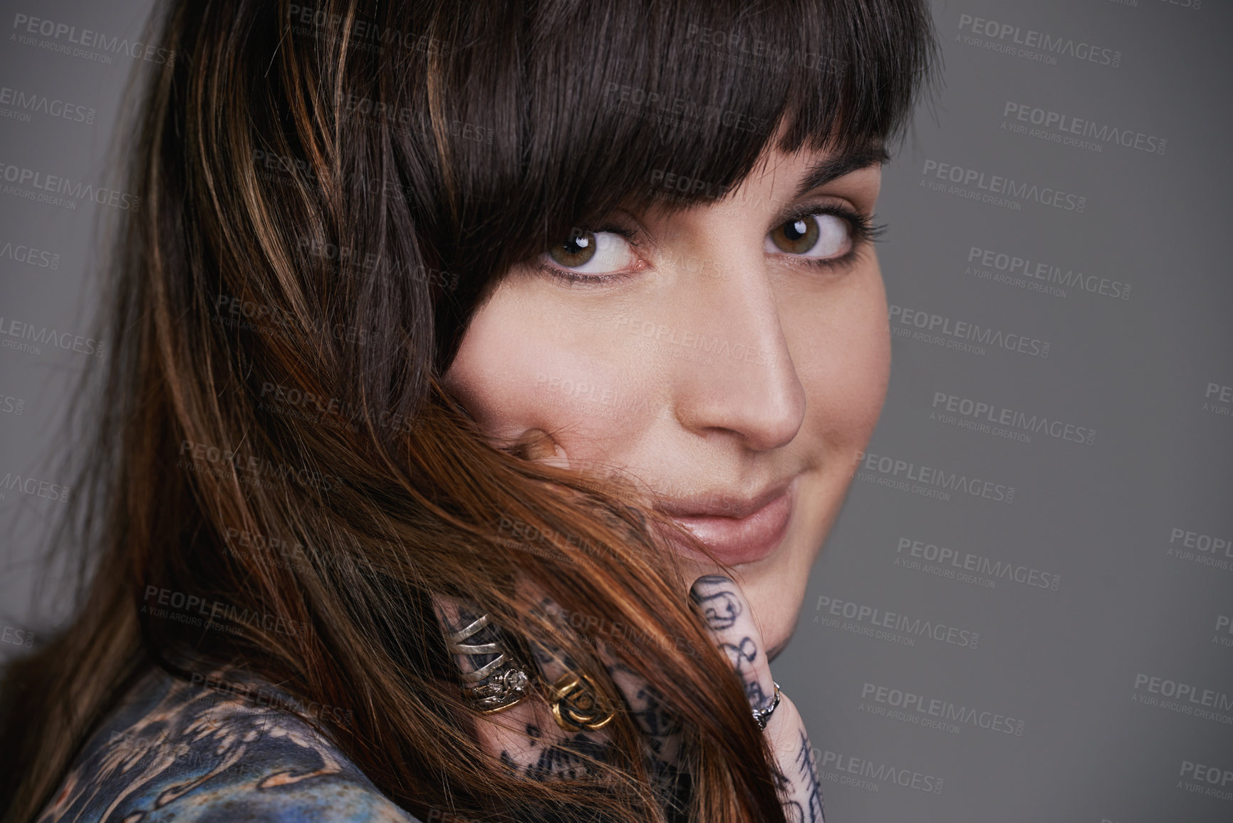 Buy stock photo Happy woman, portrait and beauty with tattoo for haircare, style or facial treatment on a gray studio background. Face of female person or young model with smile for body art, design or creativity