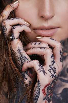 Buy stock photo A cropped shot of a tattooed young woman