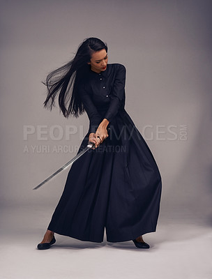 Buy stock photo Samurai, sword and japanese woman fighter, ninja or warrior  swing to fight for power, cosplay and fantasy. Asian female from Japan in black fashion with beauty, action and metal weapon for art deco