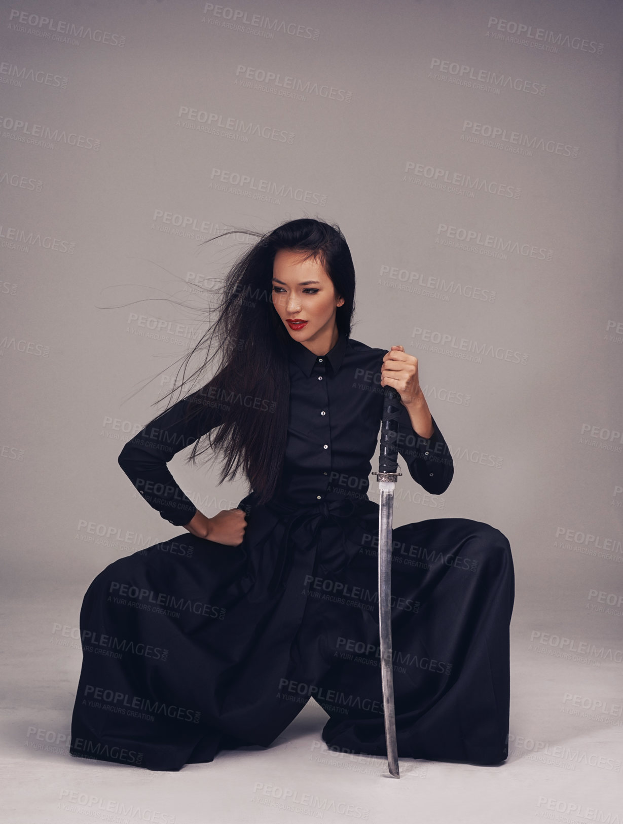 Buy stock photo Sword, asian woman and warrior ninja or samurai in studio to fight for power, cosplay and fantasy. Strong japanese female in black fashion pose with beauty, action and metal weapon for art deco