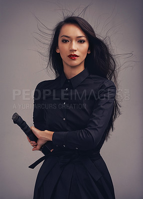 Buy stock photo Beauty portrait, sword and samurai woman art in ninja or warrior fashion to fight for power and fantasy. Asian female from Japan in black cosplay and makeup for action with metal weapon for art deco