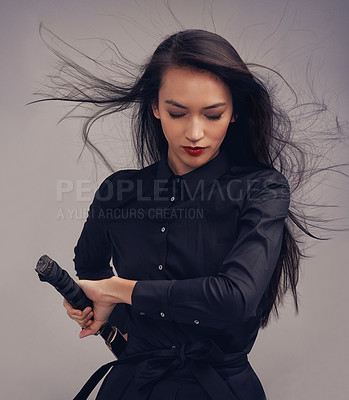Buy stock photo Samurai, ninja and woman with sword in studio isolated on a gray background. Face, sports and martial arts meditation of young female warrior holding blade ready for workout, training or exercise