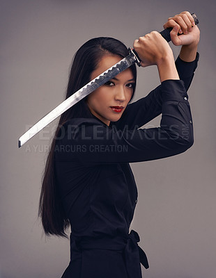 Buy stock photo Portrait, sword and samurai with a model woman in studio on a gray background for martial arts or combat. Training, fantasy and weapon with an asian ninja ready to defend using self discipline