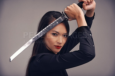 Buy stock photo Portrait, sword and warrior with a ninja woman in studio on a gray background for martial arts or combat. Training, fantasy and weapon with an asian samurai ready to defend using self discipline