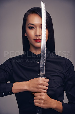 Buy stock photo Portrait, ninja and sword with warrior woman in studio on a gray background for martial arts or combat. Training, fantasy and weapon with an asian samurai ready to defend using self discipline