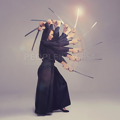 Buy stock photo Woman, warrior nun and sword in martial arts with motion blur strike against a studio background. Female wielding a sharp samurai blade, weapon or ninja fighter attacking in black cosplay