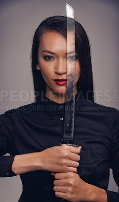 Buy stock photo Portrait, sword and warrior with an asian woman in studio on a gray background for martial arts or combat. Training, fantasy and weapon with a ninja or samurai ready to defend using self discipline