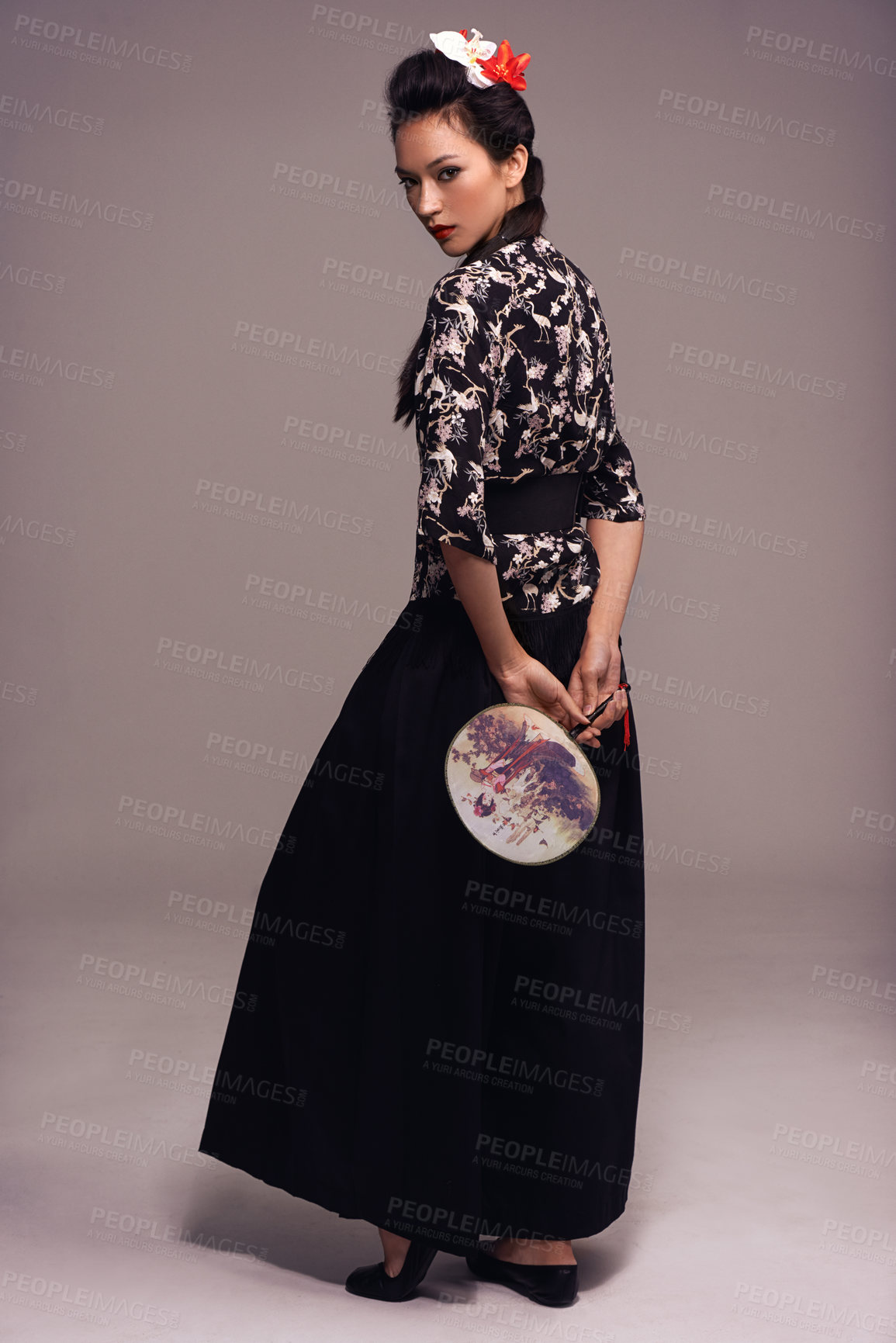 Buy stock photo Asian woman, fashion and fan in studio on brown background in confidence, traditional style and elegant. Portrait, Japanese and female person with designer, culture and outfit for heritage. 