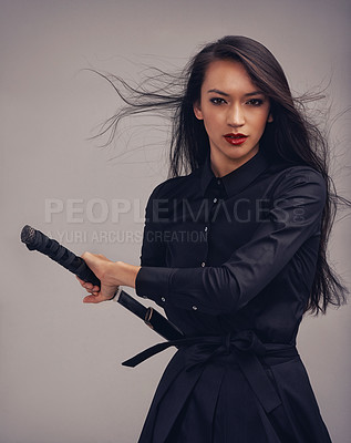 Buy stock photo Portrait, sword and ninja with an asian woman in studio on a gray background for martial arts or combat. Training, fantasy and weapon with a model samurai ready to defend using self discipline