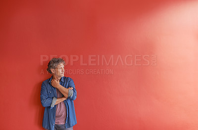 Buy stock photo Creative, thinking and mature man on red background with mockup space, ideas and inspiration. Professional insight, small business and casual person at wall with planning, brainstorming and growth