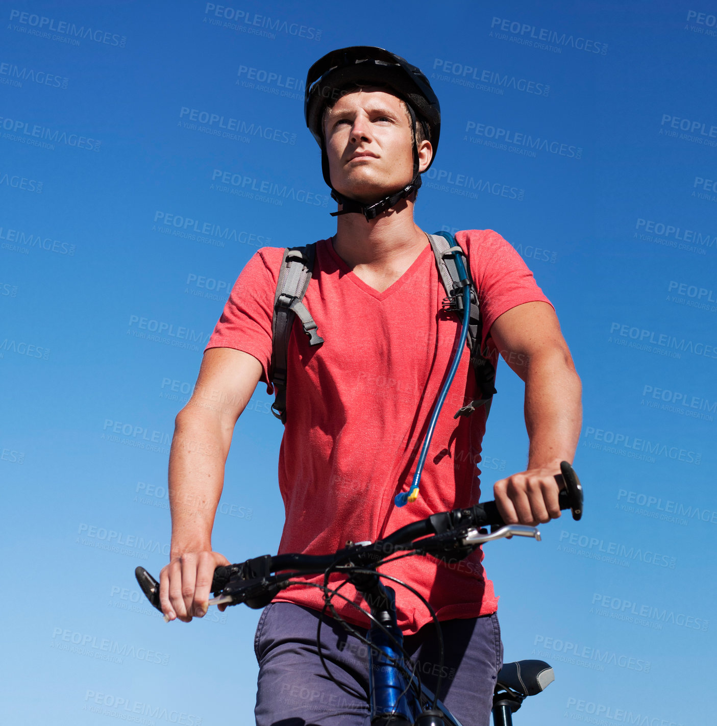 Buy stock photo Sky, bike and man focus on cycling journey, sports workout or travel adventure for fitness, exercise or outdoor cardio. Thinking, athlete training and male person riding bicycle for transportation