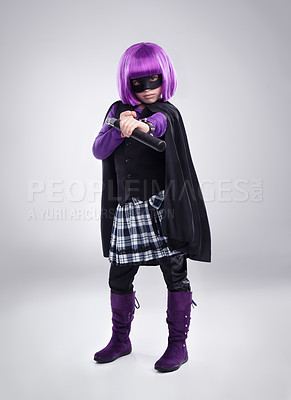 Buy stock photo Girl kid, vigilante and costume in studio portrait with weapon, fantasy and creative comic aesthetic. Child, superhero game, mask and nunchucks for martial arts, villain or cosplay by gray background