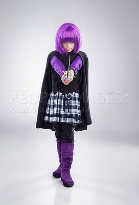 Buy stock photo Little girl, halloween and superhero dress up with sword in purple costume for warrior cosplay against a grey studio background. Portrait of isolated girl child playing in kick ass super hero outfit