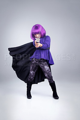 Buy stock photo Little girl, dress up and superhero costume for halloween in warrior stance with sword against a grey background. Portrait of girl in super hero cosplay, character or vigilante playing in disguise