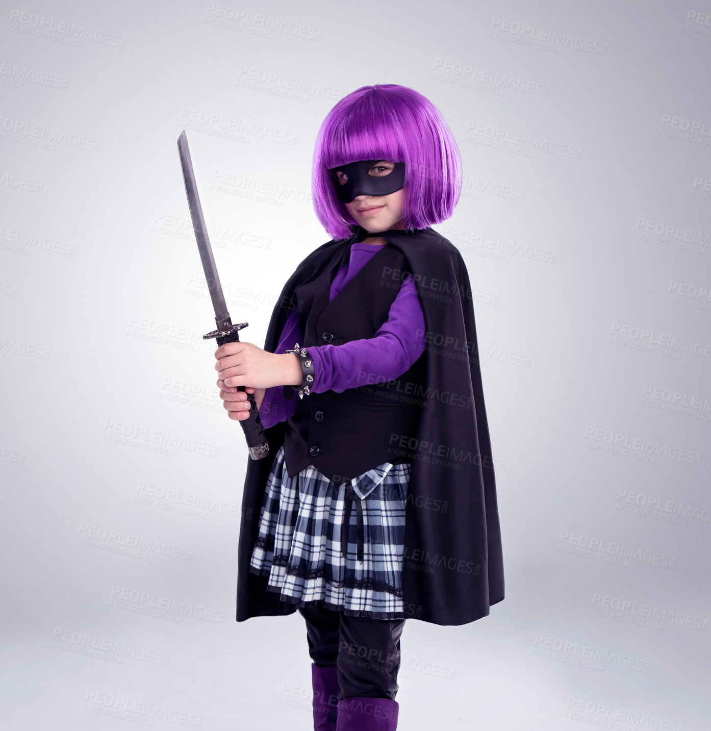 Buy stock photo Girl kid, costume and sword in studio portrait for vigilante fantasy, creative and comic aesthetic. Child, superhero mask and creativity for martial arts, villain cosplay and halloween by background