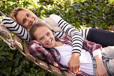 Buy stock photo Portrait, hammock and relax happy kid, mom and family bond, care or spending quality time together. Wellness, support and Australia mother, child or people enjoy Mothers Day in backyard nature garden